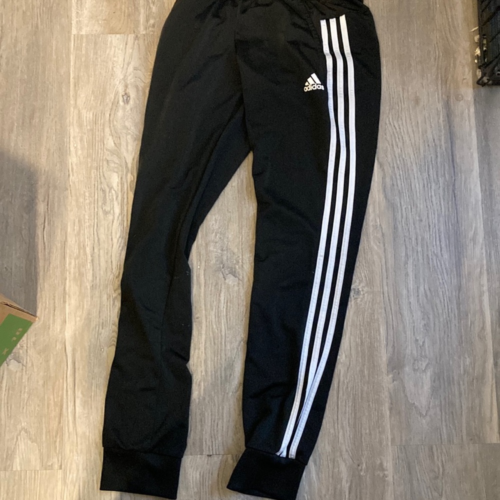 Adidas joggers nice condition unknown size looks about a woman’s small.